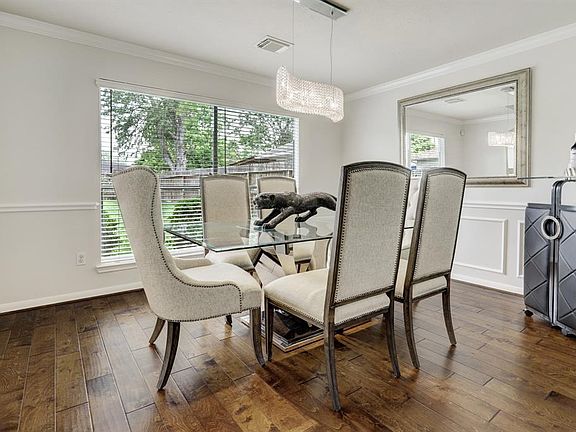 Elegant Formal Dining room offers large picture window overlooking huge backyard