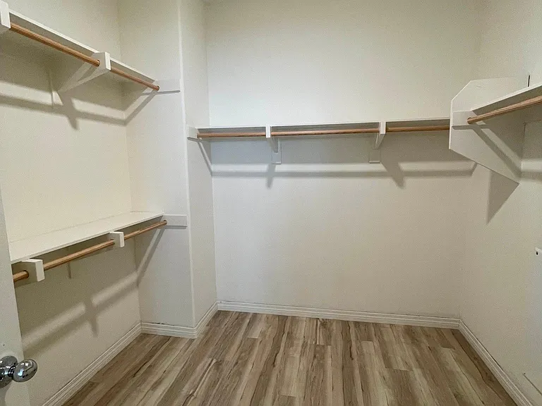 Large walk-in closet located in master bedroom