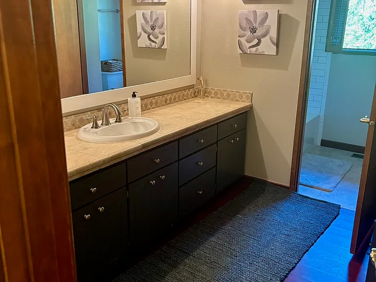 Bathroom #1 with separate tub/shower combo.