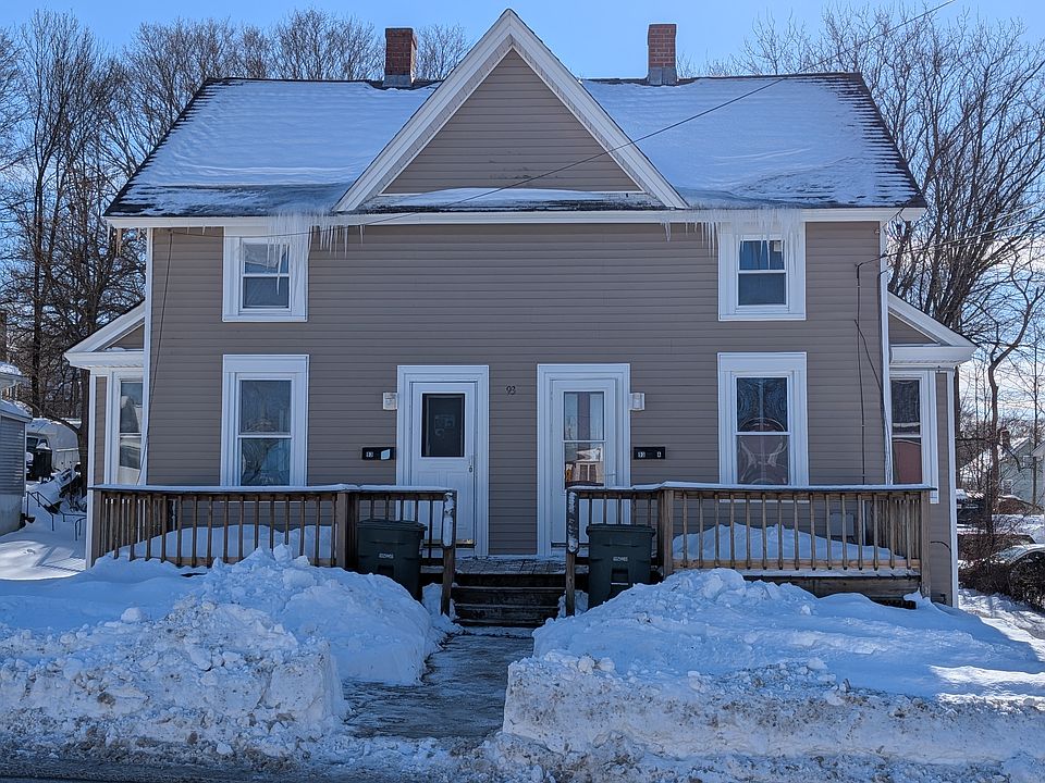 Front of house. Apartment on left side.