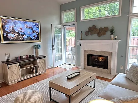 Screened back door from living room with wide screen Roku TV.
