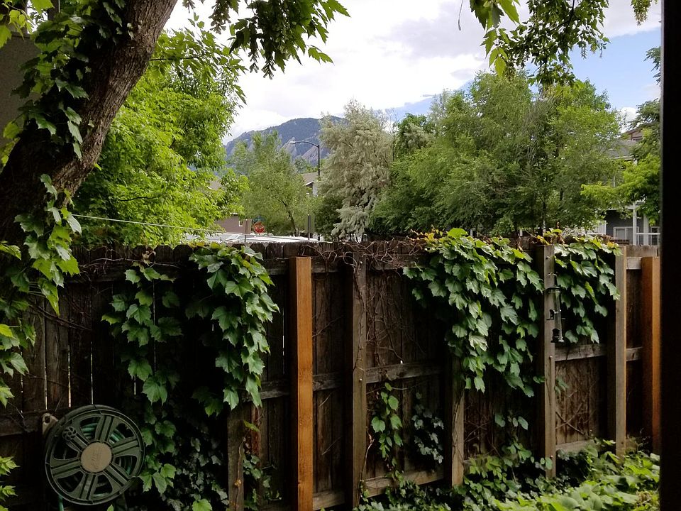 Private fenced garden with a view of the Flatirons