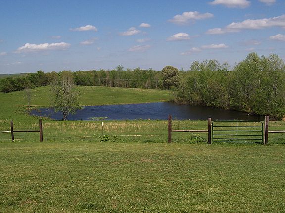 Pond and land behind house