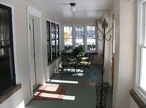 Inviting, enclosed porch
