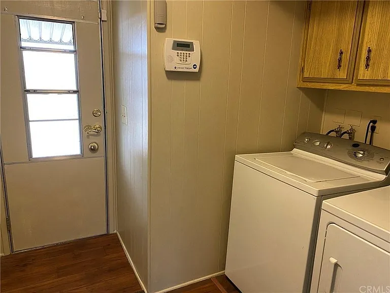 Laundry Room with rear door access to garage