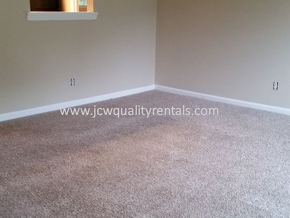 Living Area with Window into Kitchen