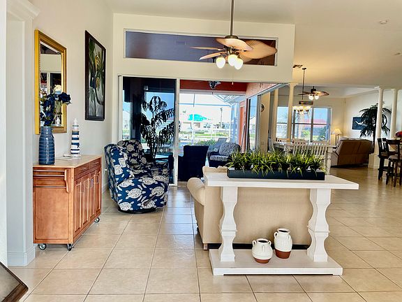 Entry sitting area with view out to pool and lanai