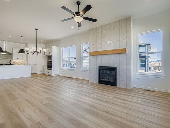 Plan C416 living room kitchen dining room representative photo