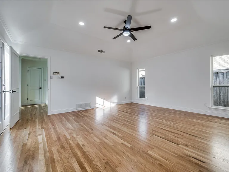 Primary bedroom is split from 2 secondary bedrooms
