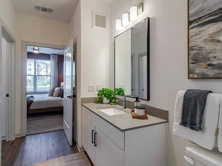 Quartz-topped vanity positioned just off the bedroom for an easy daily flow. Quartz-topped vanity positioned just off the bedroom for an easy daily flow.