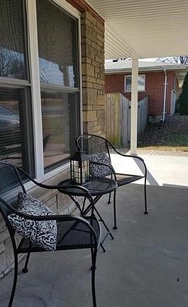 Covered front porch is able to accommodate seating for enjoying your favorite beverage and people watching.  Paul Avenue is a wide street with sidewalks on both sides.