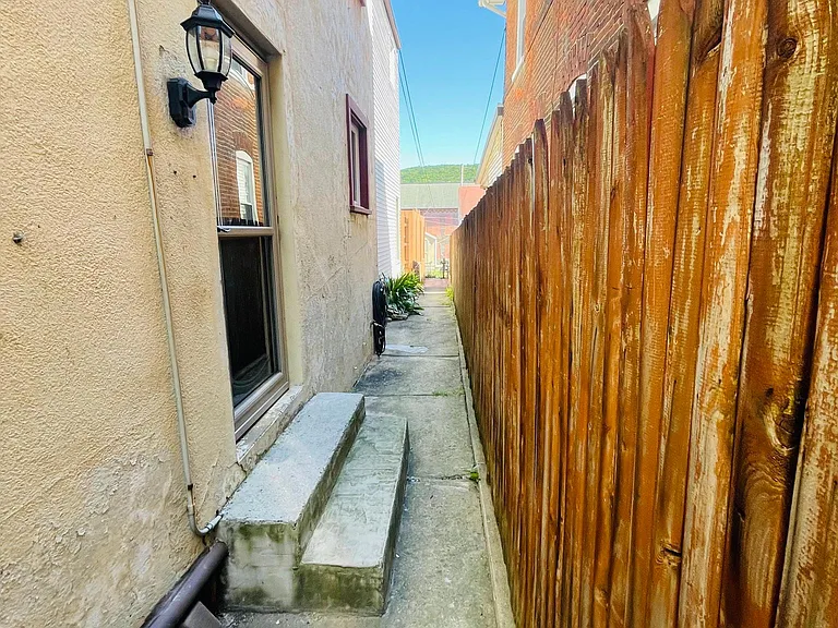 Walkway to the entrance and the backyard