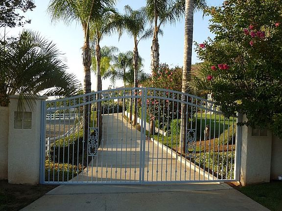 entire 2 acres is gated and fenced - great for dogs