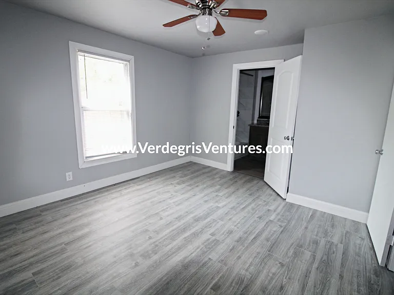 The studio or home_office/second living area includes a south_facing window, a door for privacy, and convenient access to the second bathroom. Though compact, it offers a flexible space ideal for work or additional living needs