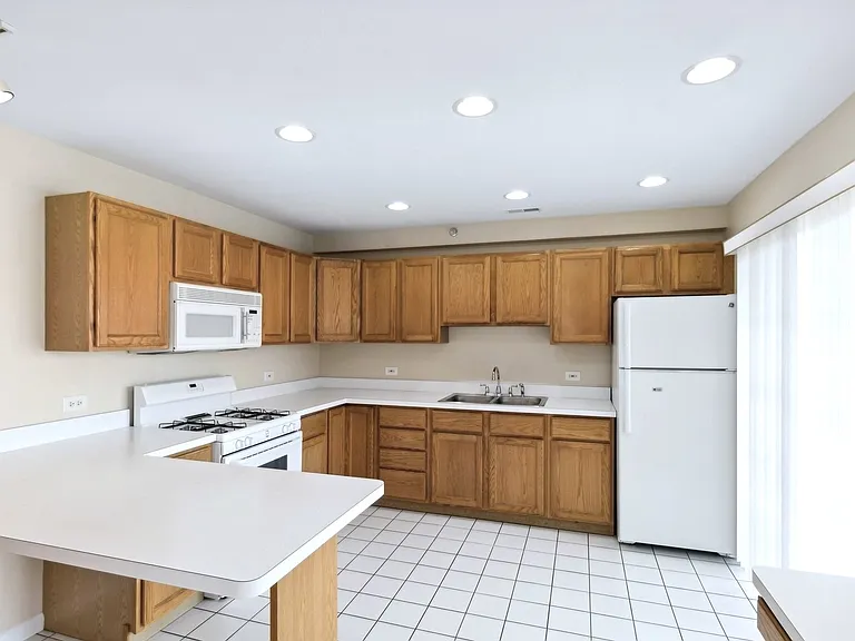 Kitchen and balcony to the right.