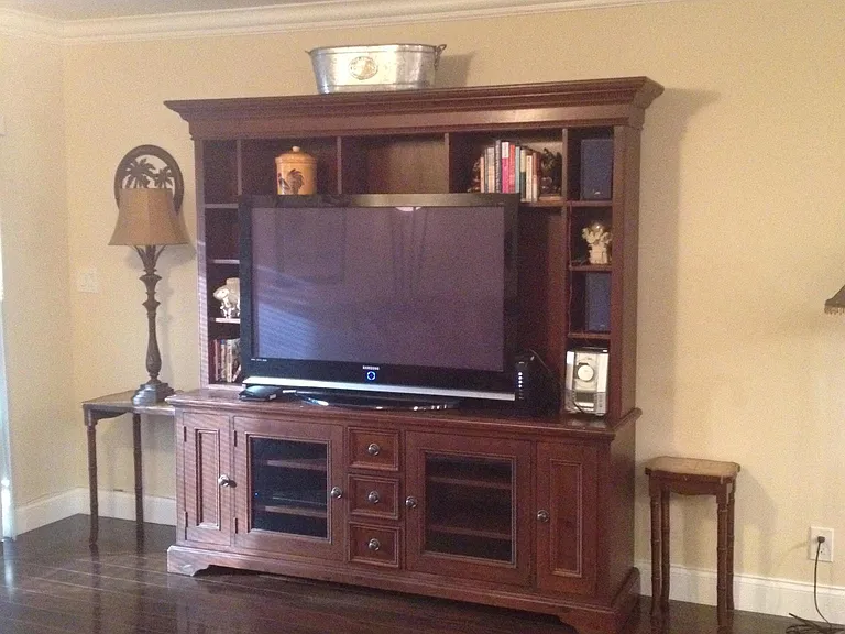 Large smart TV in wall unit in living room