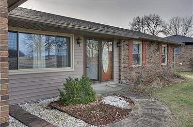 Front door entrance is inviting with cobblestone walkway.
