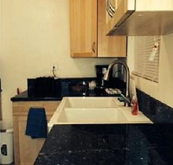 Partial view of kitchen - all new in granite, stainless stee