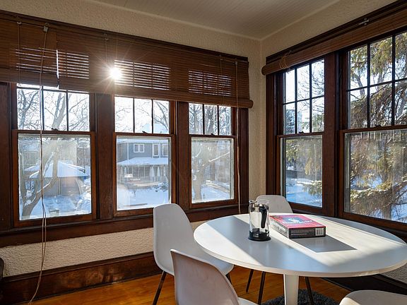Pleasant outlook to treetops and quiet residential street from sun porch.