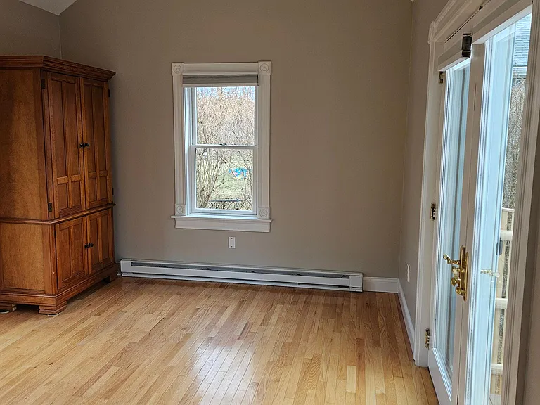 spacious bedroom filled with light