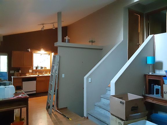 kitchen. Upstairs: master bedroom with full attached bath and additional bedroom. Downstairs two additional bedrooms with full bath / laundry combo (washer & dryer not included).