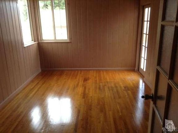 Bedroom with private entrance off backyard.