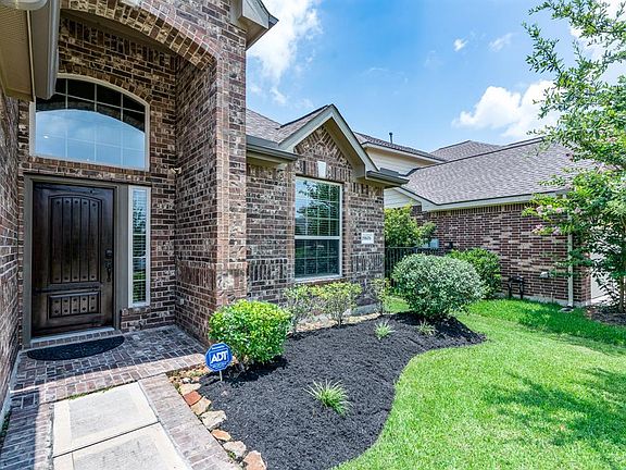 The curved sidewalk leads you to this charming covered front porch area!