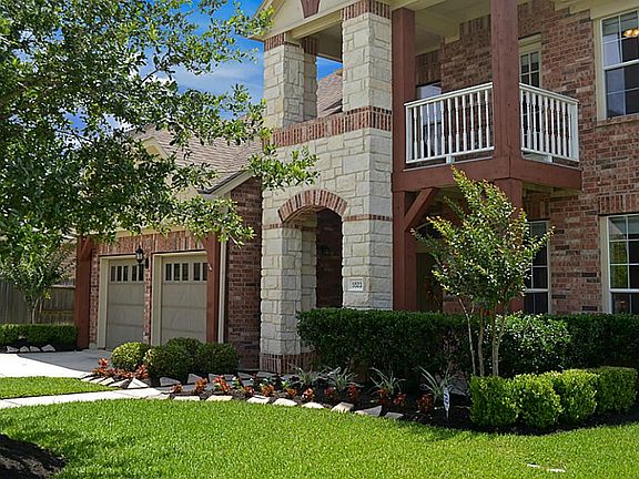 Beautiful, mature landscaping softens the exterior while the larger covered Deck not only draws atte