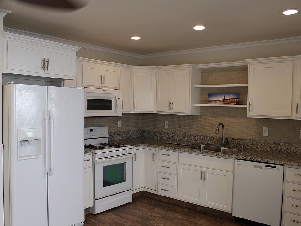 Recent Remodeled Kitchen with built in microwave, gas stove, refrigerator with ice and water, dishwasher, Granite counters through out the home.