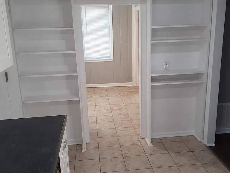 Pantry area, utility room beyond with Washer and Dryer included