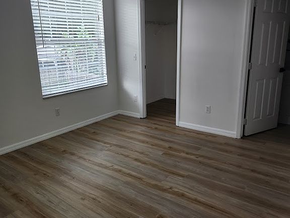 Bedroom has private bath, walk in closet, new black ceiling fan with light kit.