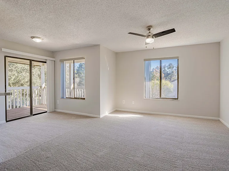 Experience openness and light with a bright living room leading to a private balcony.