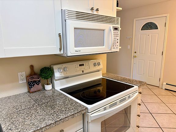 Updated Kitchen, includes microwave, oven/range, refrigerator, dishwasher and garbage disposal.