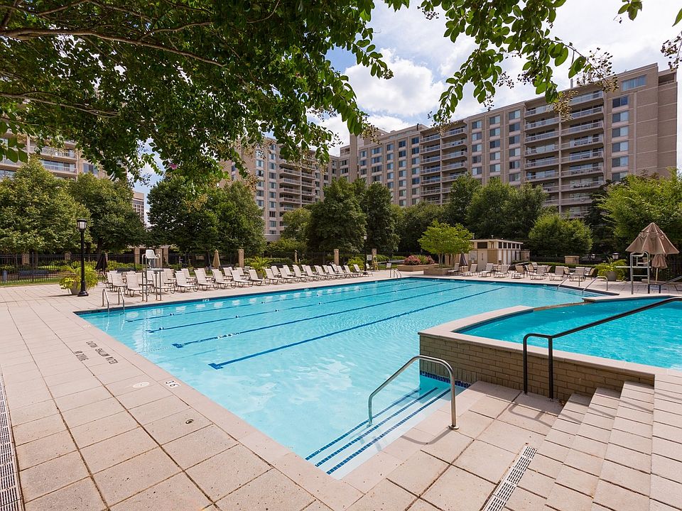Olympic-Sized Pool with Swimming Lanes, Free Swim Area, and Expansive Sundeck with Chaise Lounge Chairs