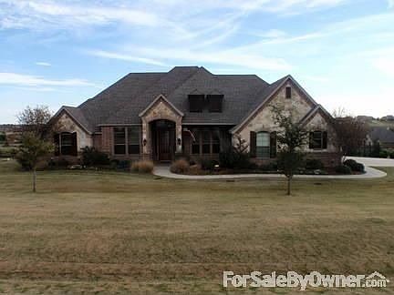 Beautiful custom home
						:
						Front yard professionally landscaped
