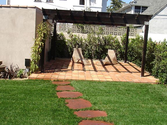 View of backyard and pergola