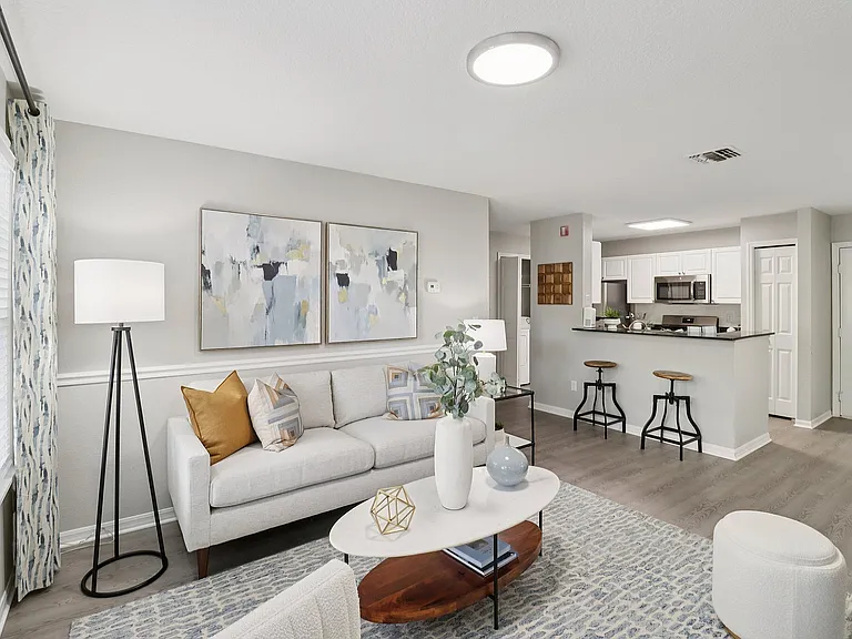 Spacious open-concept living area with seamless flow into the kitchen