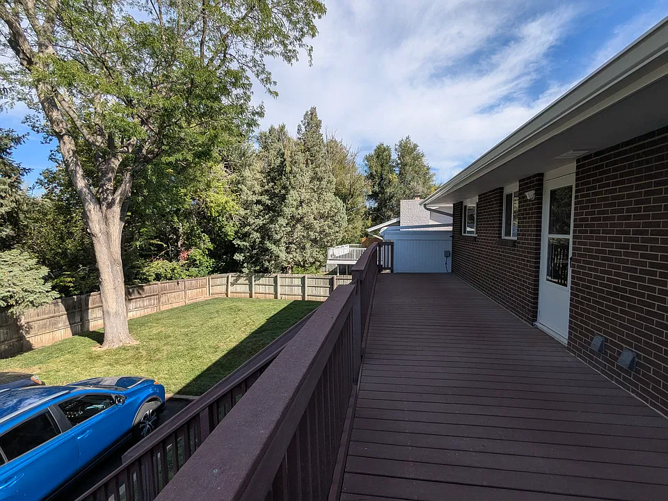 Large deck overlooks the back yard.