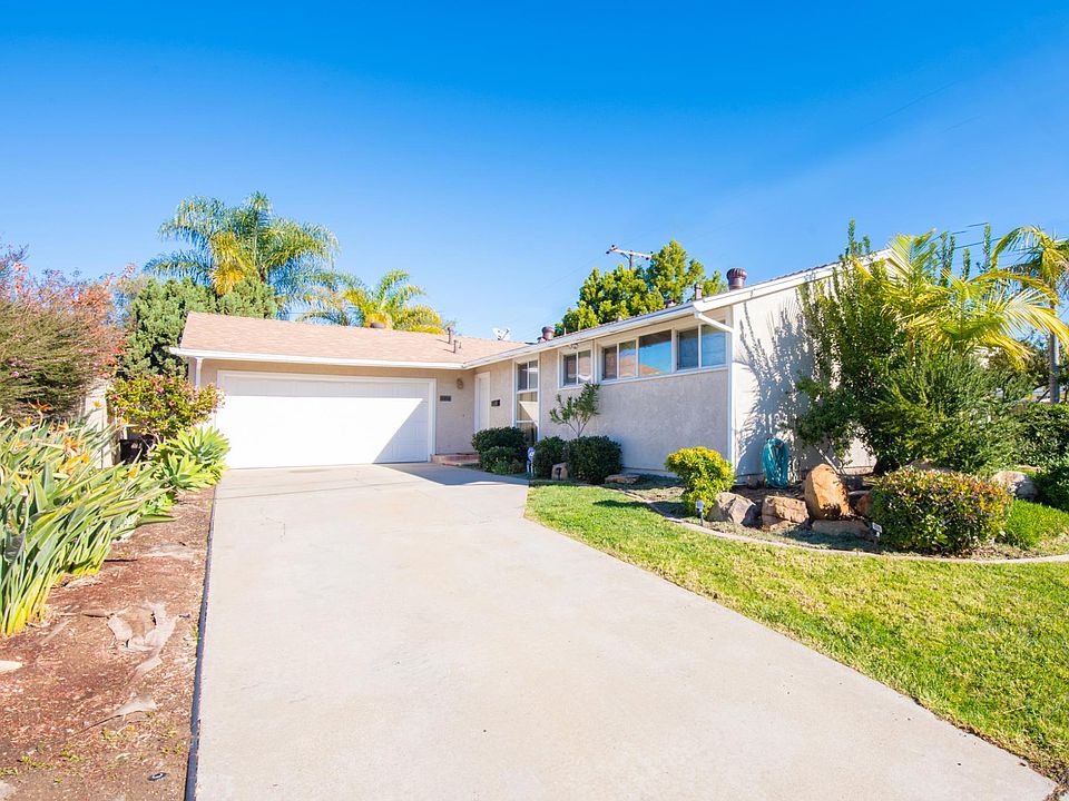 Extra long driveway for parking multiple vehicles, along with 2-car garage.