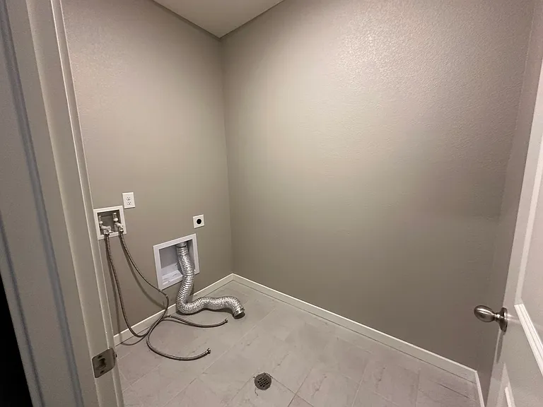Laundry room with a space for full size washer and dryer. Washer and dryer could be provided upon request