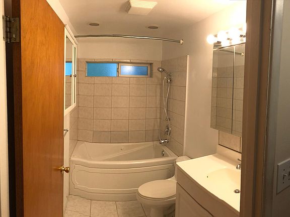 Bathroom with jetted tub.