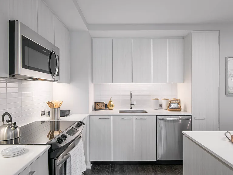 Contemporary kitchens include glass tile backsplash, premium quartz countertops, and designer lighting