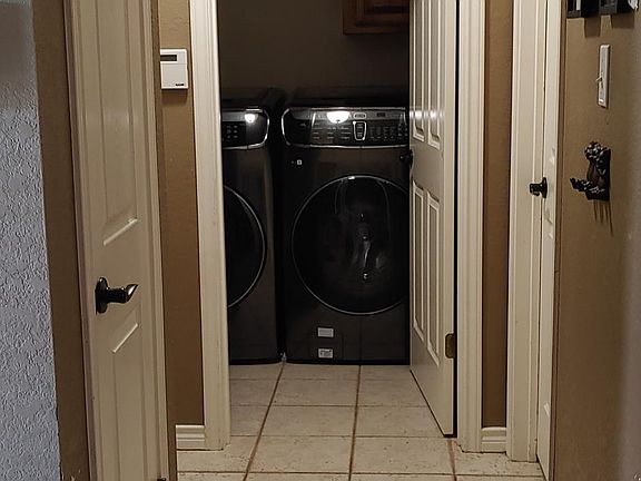 Hall to the laundry room and master Bedroom.