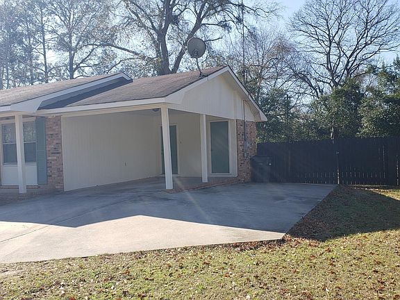 View of Carport & additional parking area; Freshly painted on outside