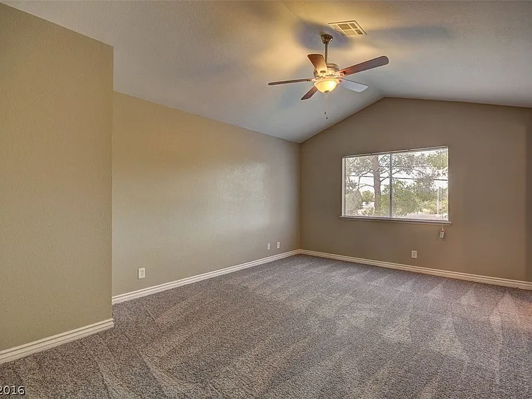 The flooring has been upgraded to laminate_there is no longer any carpet in this room