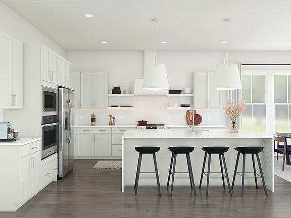 Kitchen featuring vast island pendant lights