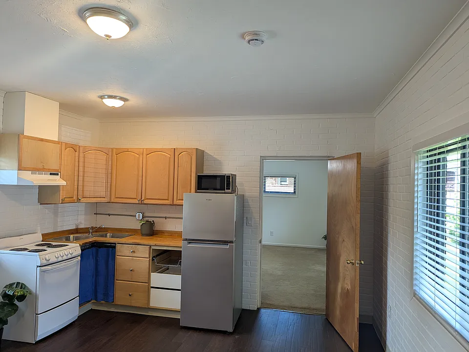 Kitchen, bedroom door view from living area
