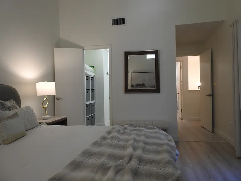 Primary bedroom view to the entry and bathroom