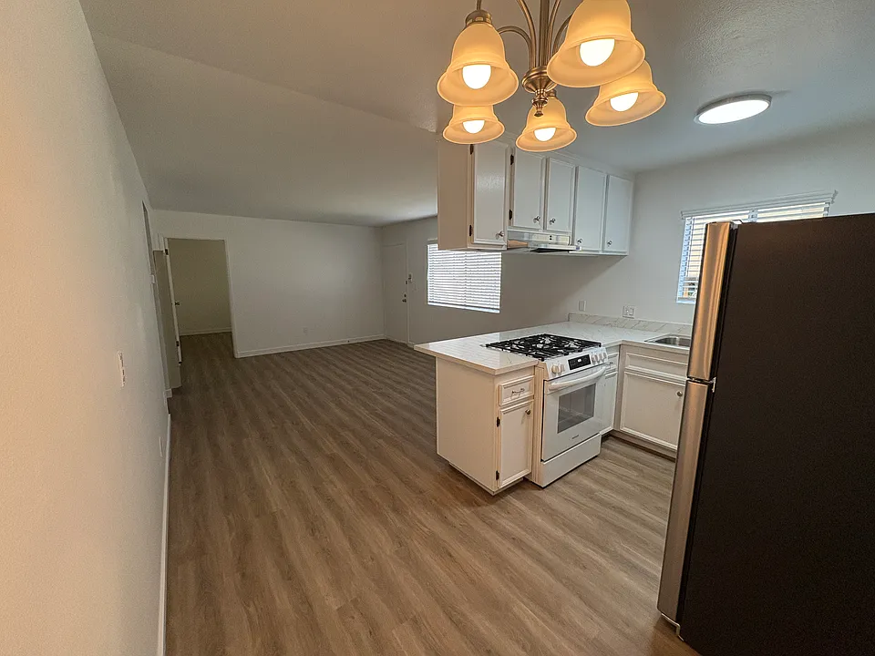 Kitchen View to Living Room and Office off the Living Room