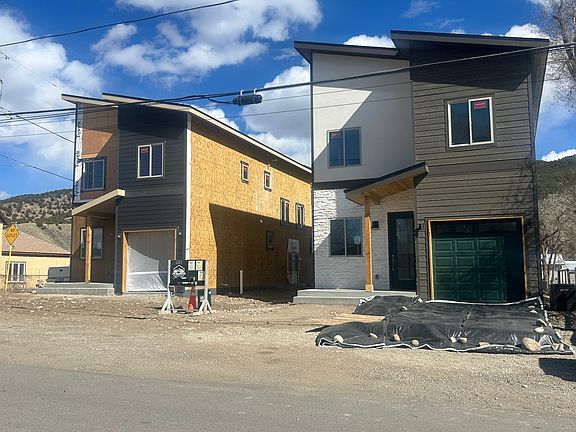 Front of duplex. This unit is behind the dupplex on the right. The duplex on the left should be finished in June. All landscaping and fencing to be completed by May.
